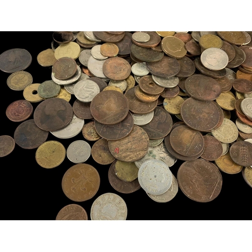 715 - A large quantity of British and foreign coins in a wooden trunk. Trunk measures 35 x 22 x 25cm.