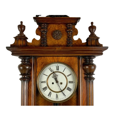 340e - A large Victorian Vienna wall clock. With weights and pendulum. 127cm