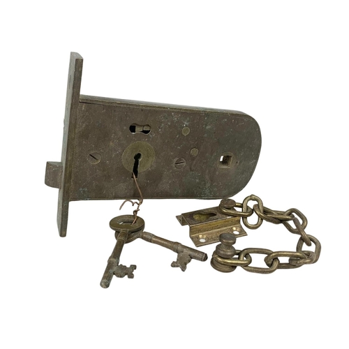 378a - An early 20th century door lock. 16cm.