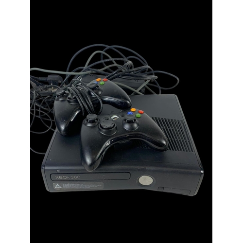 141b - 2 XBOX 360 consoles, with 2 controllers, leads and games.