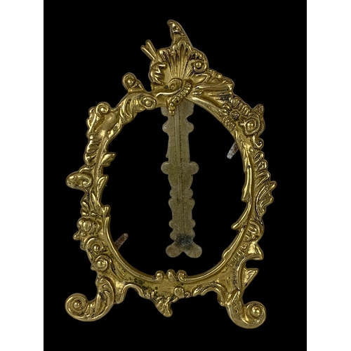 332 - A set of 4 matching ornate brass photo frames in the 18th century style. Largest pair measures 20cm.