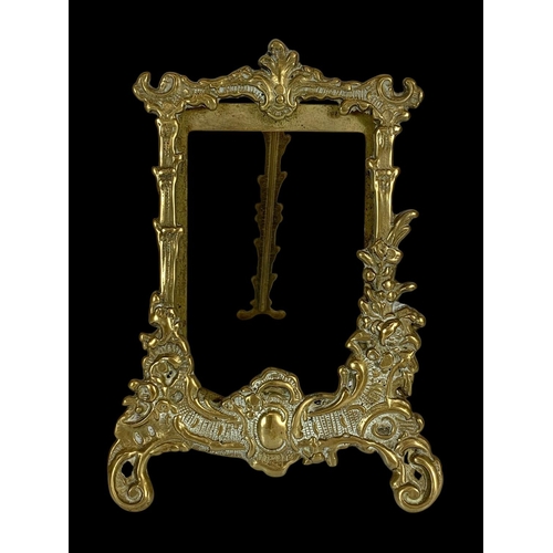 333 - A quantity of ornate brass photo frames in the 18th century style. Largest measures 31cm.