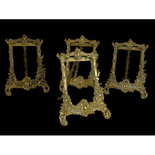 333 - A quantity of ornate brass photo frames in the 18th century style. Largest measures 31cm.