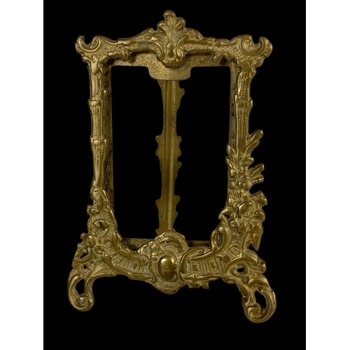 333 - A quantity of ornate brass photo frames in the 18th century style. Largest measures 31cm.