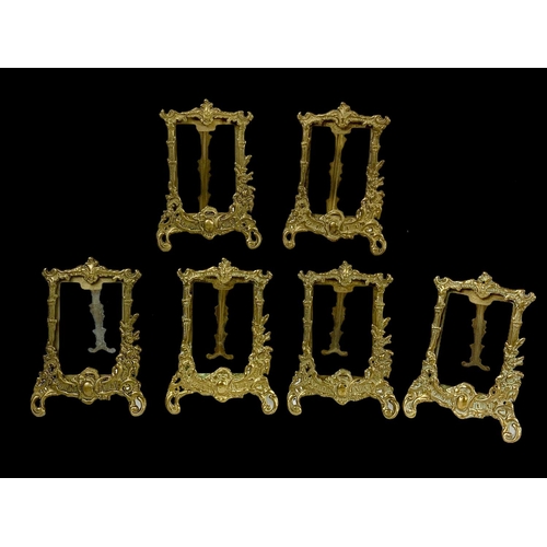 333 - A quantity of ornate brass photo frames in the 18th century style. Largest measures 31cm.