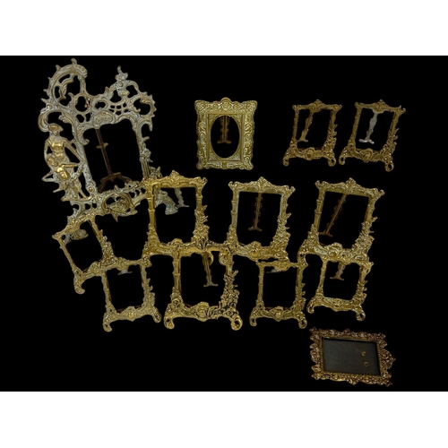 333 - A quantity of ornate brass photo frames in the 18th century style. Largest measures 31cm.