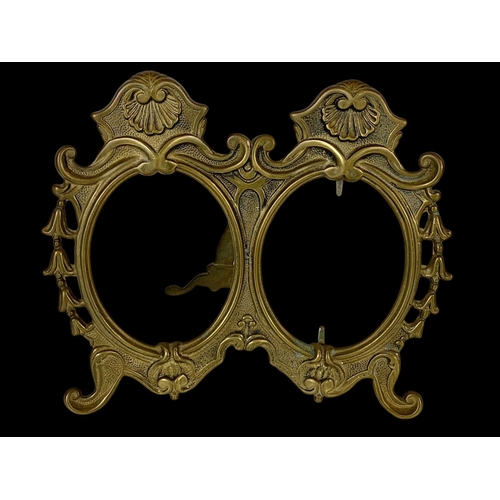 334 - 3 matching ornate brass photo frames. 23 x 19.5cm.