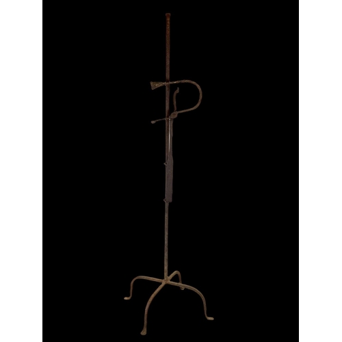 339 - An 18th century style Rush light, 140cm