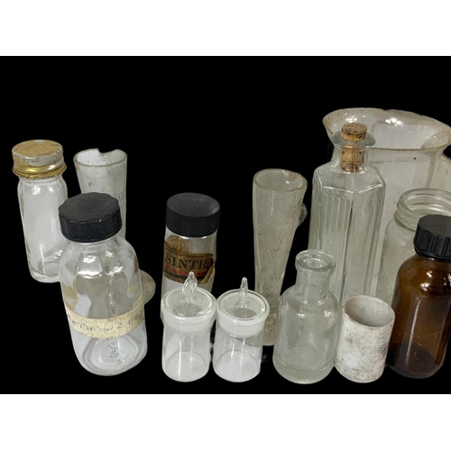 372 - A quantity of vintage chemist bottles etc.