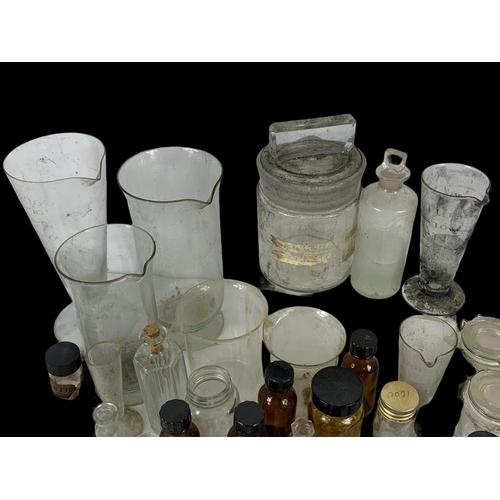 372 - A quantity of vintage chemist bottles etc.