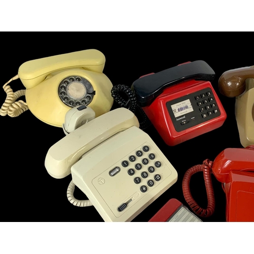 389B - A quantity of vintage telephones.