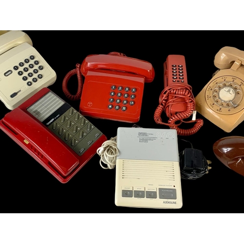 389B - A quantity of vintage telephones.