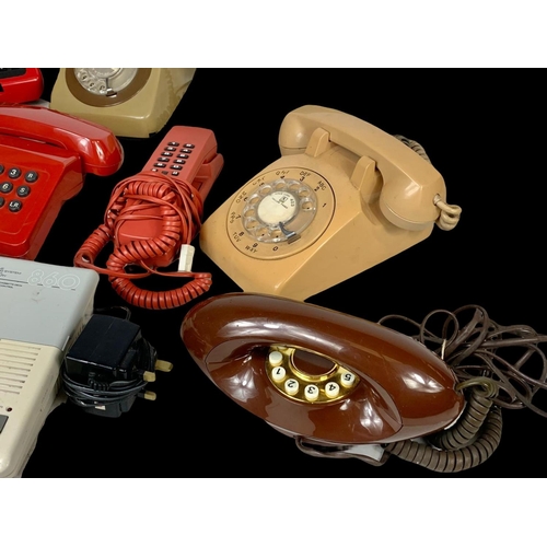 389B - A quantity of vintage telephones.