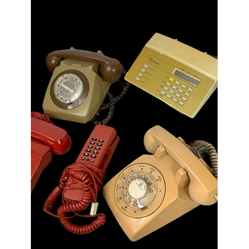 389B - A quantity of vintage telephones.