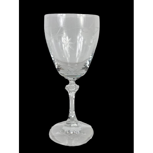 639 - A set of 6 etched crystal wine glasses. 17.5cm