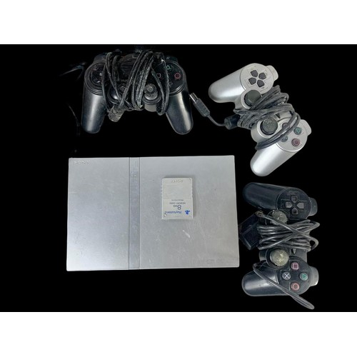 141a - A PlayStation 2 with PlayStation 2 and PlayStation 3 games, with controllers, memory card and leads