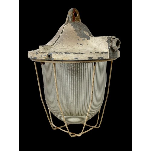 737 - A vintage industrial caged light.  28cm