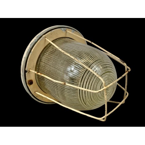 737 - A vintage industrial caged light.  28cm