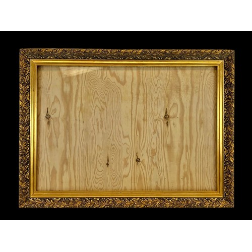 306f - A large vintage ornate gilt frame with glass. 114 x 84cm.