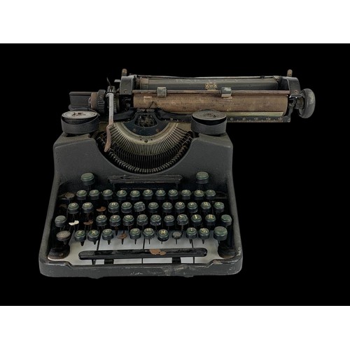 306i - An early 20th century cast iron type writer by Bar-Lock. 29 x 36cm.