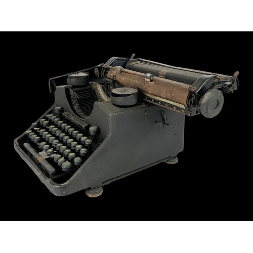 306i - An early 20th century cast iron type writer by Bar-Lock. 29 x 36cm.