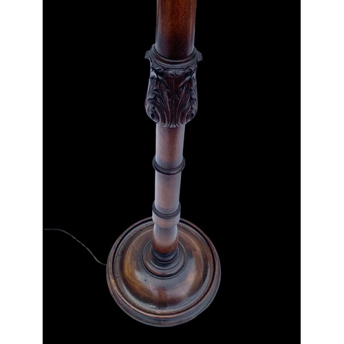 1179 - A vintage carved mahogany standard lamp. 155cm