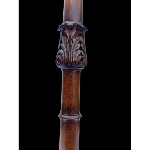 1179 - A vintage carved mahogany standard lamp. 155cm