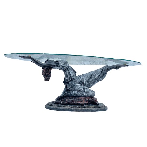 1180 - An Art Deco style glass top coffee table. 125 x 65 x 43cm.