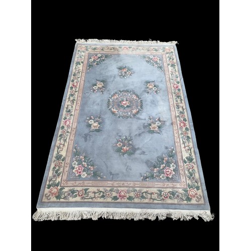 928b - A large Chinese wool rug. 180 x 300cm.