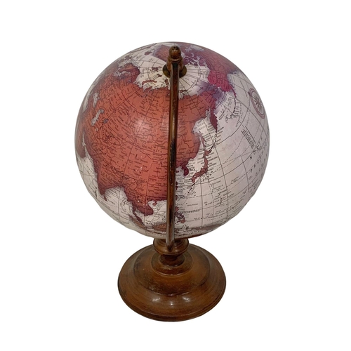 13 - A large table top revolving globe. 47cm.