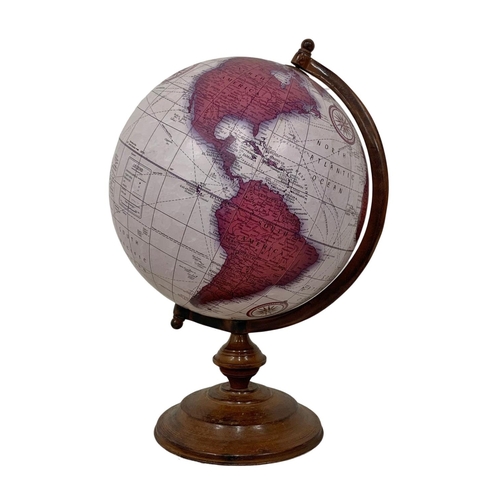 13 - A large table top revolving globe. 47cm.