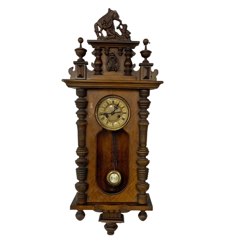 359 - A Victorian Vienna wall clock with pendulum. No glass. 43 x 110cm.