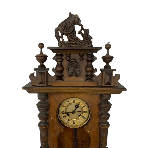 359 - A Victorian Vienna wall clock with pendulum. No glass. 43 x 110cm.