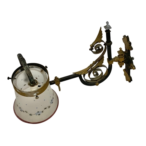 288 - A pair of large late Victorian ornate brass wall mounted gas lamps. 52cm.