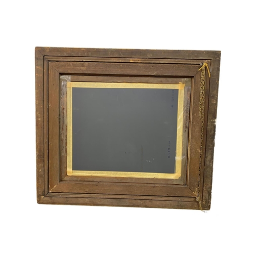 290 - A Victorian ornate gilt framed mirror. 87.5 x 77.5cm.