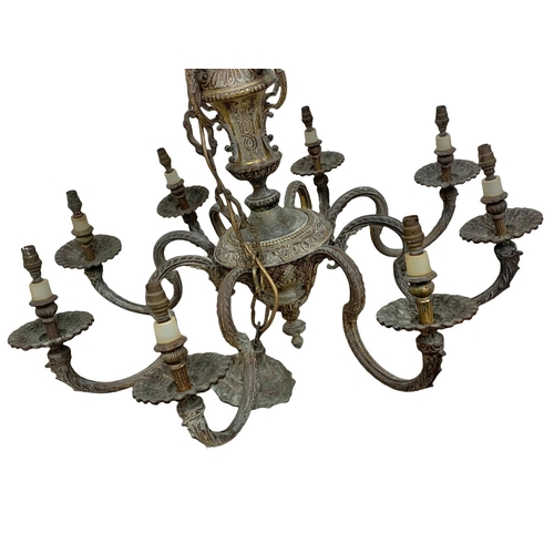 295 - A large vintage ornate heavy brass chandelier. 78 x 111cm.