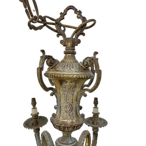 295 - A large vintage ornate heavy brass chandelier. 78 x 111cm.