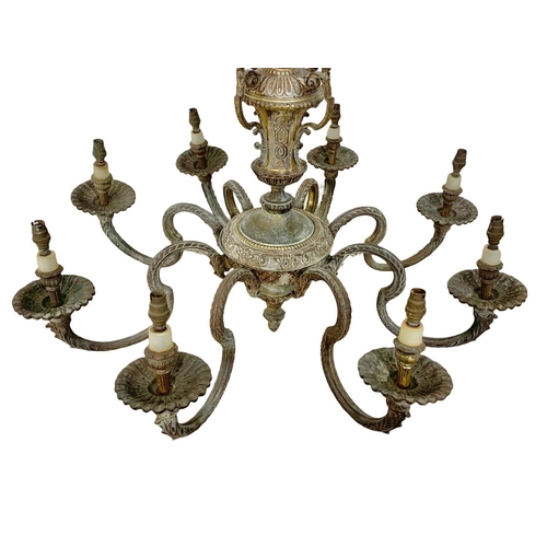 295 - A large vintage ornate heavy brass chandelier. 78 x 111cm.