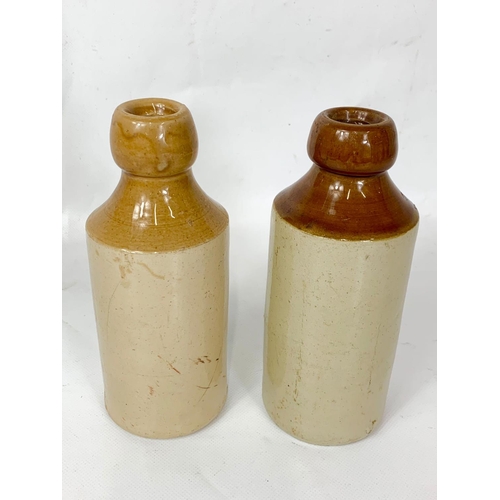 10 - 2 vintage stoneware bottles, 17cm