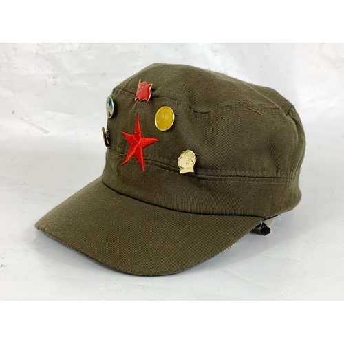 106 - A Chinese military cap and badges