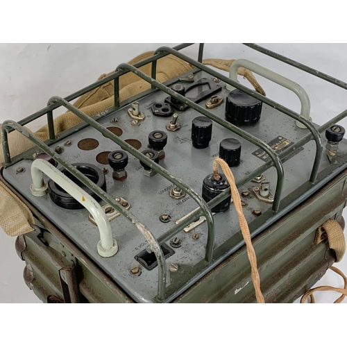 131 - A WWII radio set with headphones, dated 1943