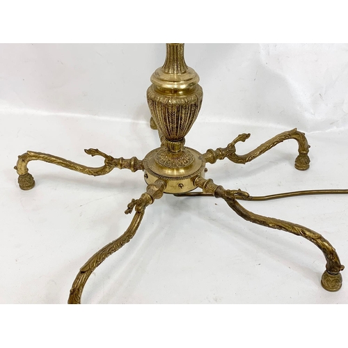 144 - A 1970s brass floor lamp, 136cm