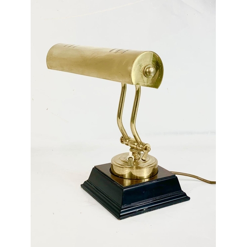 148 - A brass desk lamp, 27cm