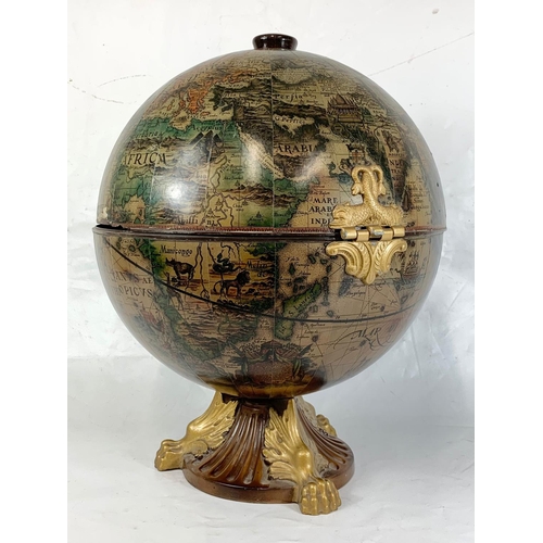 17 - A decorative table top drinks globe, 55.5cm