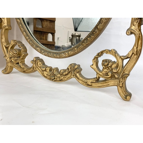 174 - A vintage gilt dressing mirror