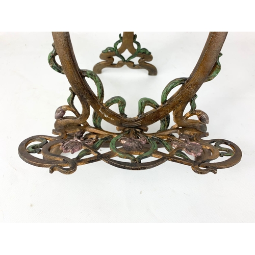 180 - A pair of Art Nouveau style metal easels.  64cm