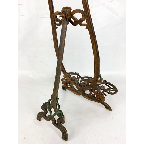 180 - A pair of Art Nouveau style metal easels.  64cm