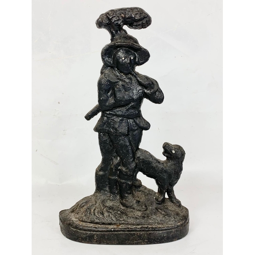 182 - A Victorian style cast iron door stop.  39cm