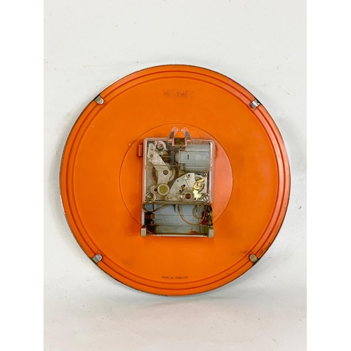 186 - A 1960's METAMEC wall clock.  22cm