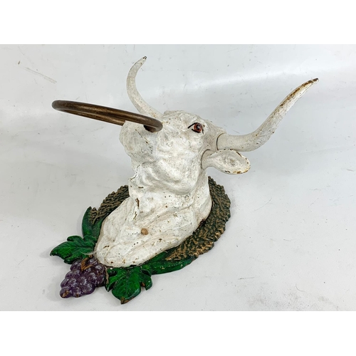 194 - A cast iron bull head.  17cm